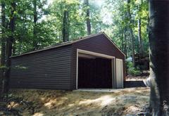 24x28 Gable Garage with 5/12 roof pitch, walk door and vinyl siding in Virginia built by Sheds by Ken